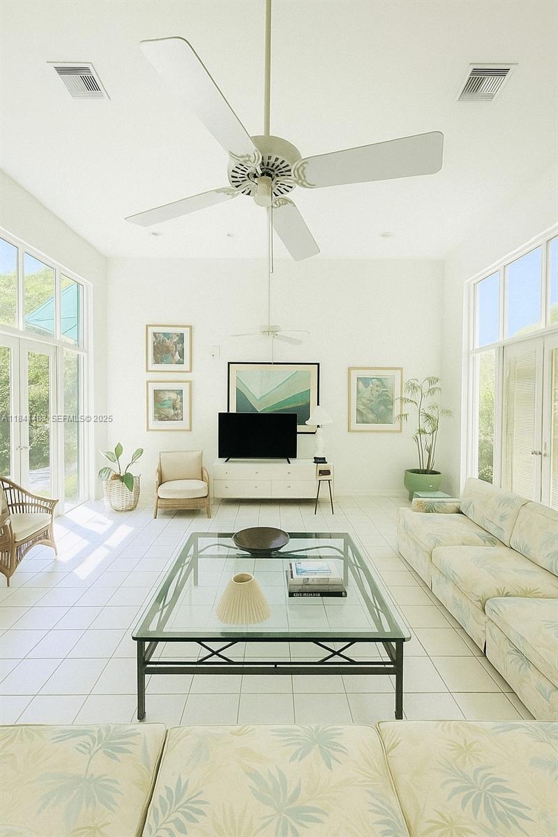 6002 Southwest 79th Court Miami, FL 33143 - Photo 38 of 47 a living room with furniture and a flat screen tv