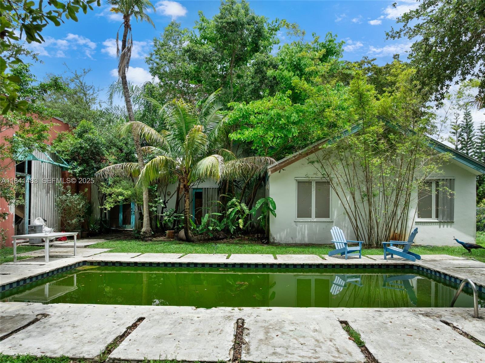 6002 Southwest 79th Court Miami, FL 33143 - Photo 4 of 47 a front view of house with yard and green space