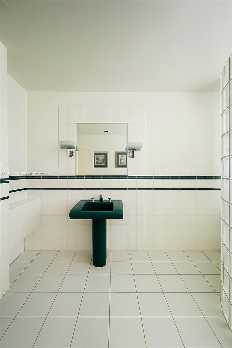 6002 Southwest 79th Court Miami, FL 33143 - Photo 44 of 47 a view of a room with racks on the wall