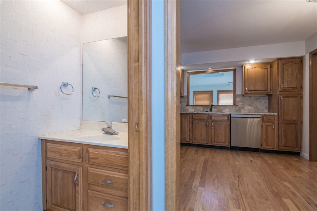 14 B Castle Hills Road, Unit 14B Agawam, MA 01001 - Photo 17 of 31 a bathroom with a sink a mirror and a bathtub