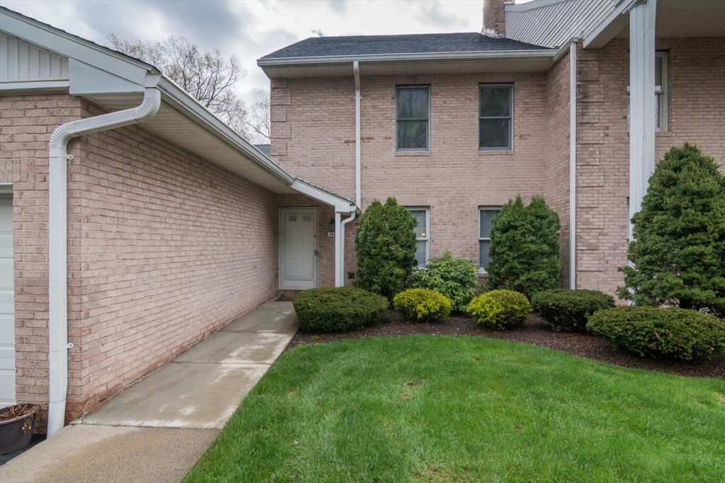 14 B Castle Hills Road, Unit 14B Agawam, MA 01001 - Photo 2 of 31 a front view of a house with a garden