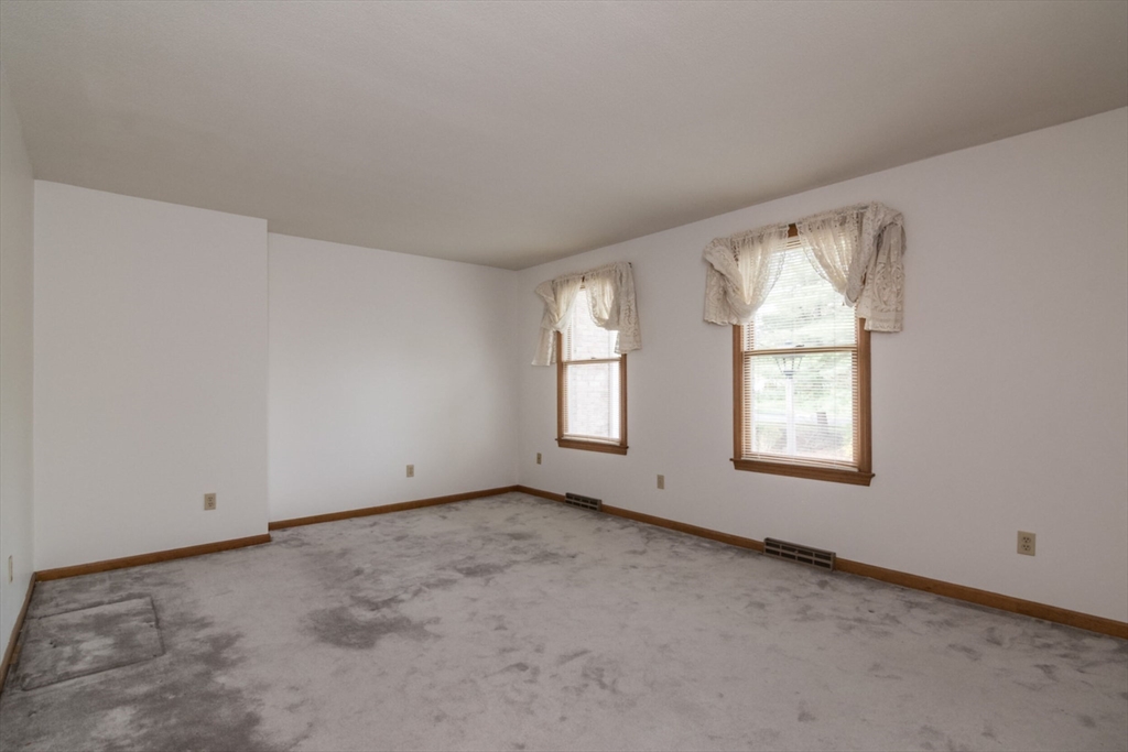 14 B Castle Hills Road, Unit 14B Agawam, MA 01001 - Photo 21 of 31 an empty room with windows