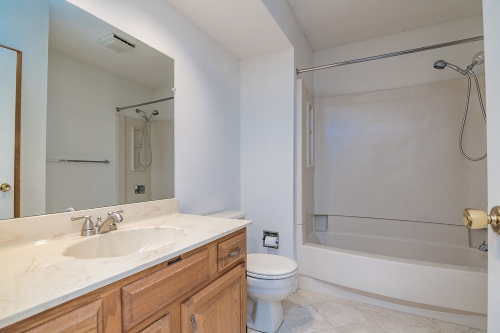 14 B Castle Hills Road, Unit 14B Agawam, MA 01001 - Photo 22 of 31 a bathroom with a granite countertop sink toilet and shower
