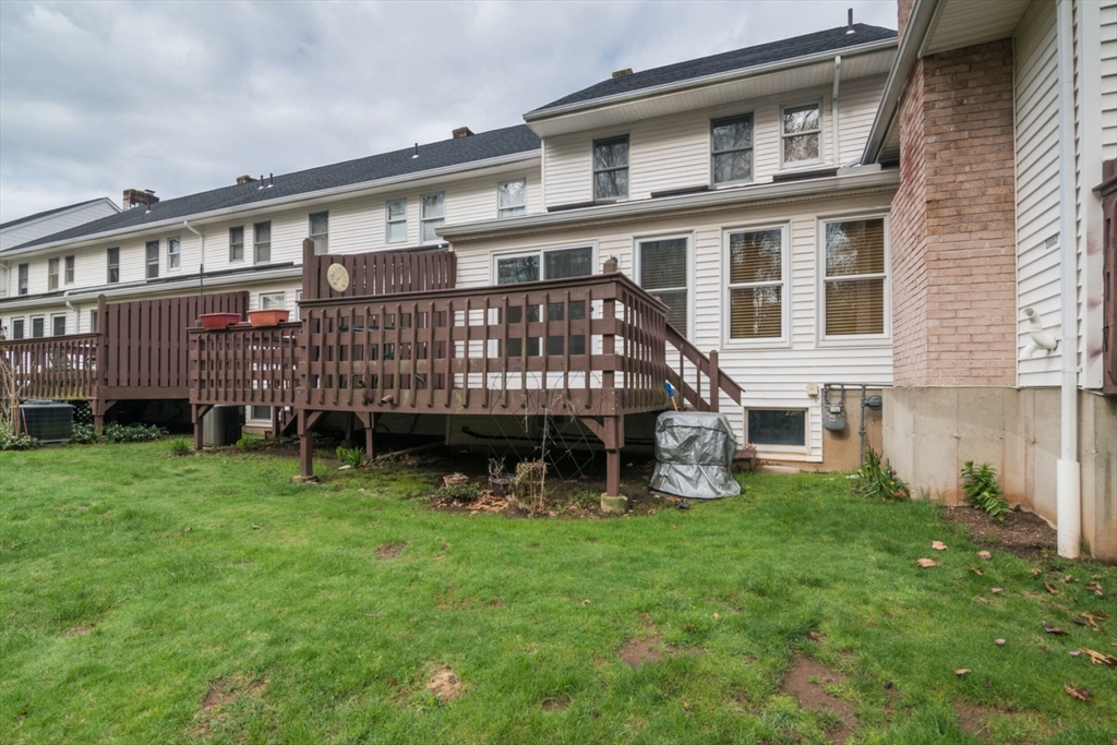 14 B Castle Hills Road, Unit 14B Agawam, MA 01001 - Photo 27 of 31 a view of a house with a yard and sitting area