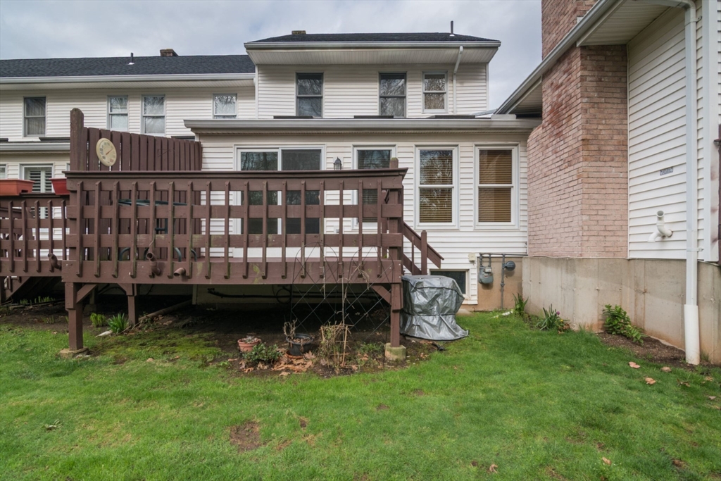 14 B Castle Hills Road, Unit 14B Agawam, MA 01001 - Photo 28 of 31 a view of a house with a yard and sitting area