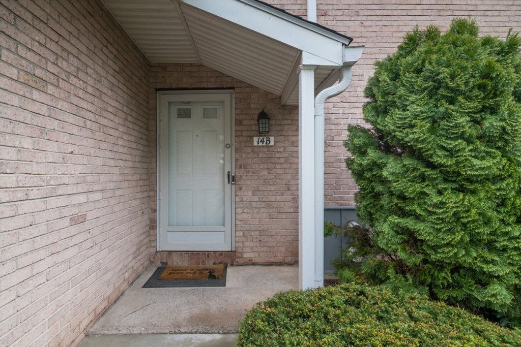 14 B Castle Hills Road, Unit 14B Agawam, MA 01001 - Photo 29 of 31 a front view of a house with a yard