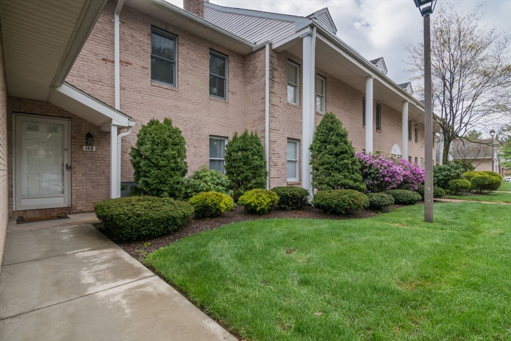 14 B Castle Hills Road, Unit 14B Agawam, MA 01001 - Photo 3 of 31 a front view of a house with garden