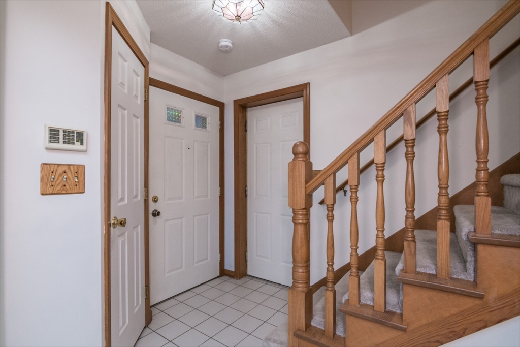 14 B Castle Hills Road, Unit 14B Agawam, MA 01001 - Photo 4 of 31 a view of an entryway with wooden floor and stairs