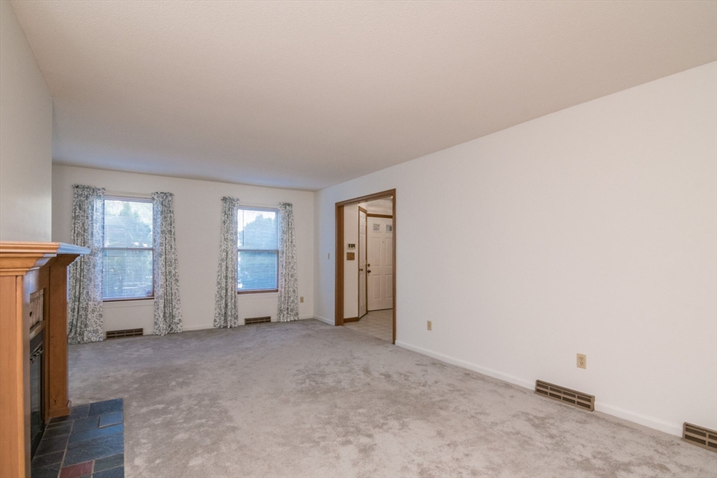 14 B Castle Hills Road, Unit 14B Agawam, MA 01001 - Photo 7 of 31 an empty room with windows