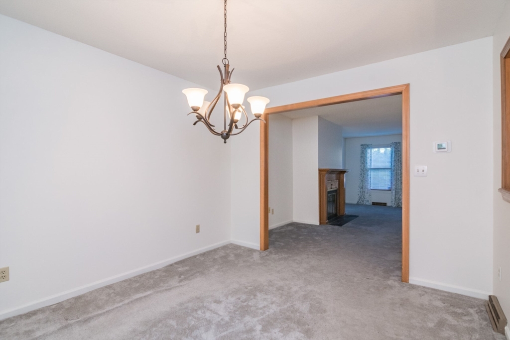 14 B Castle Hills Road, Unit 14B Agawam, MA 01001 - Photo 10 of 31 a view of a chandelier in big room and chandelier