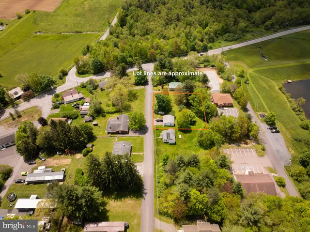 a kitchen with stainless steel appliances a refrigerator sink and cabinets