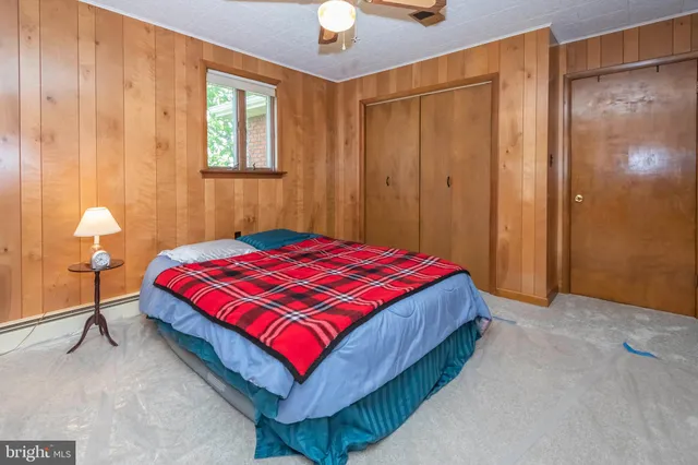 a view of an empty room with wooden walls