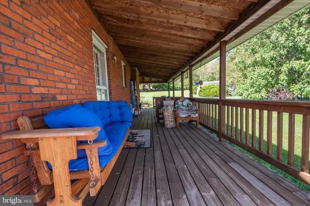 a view of balcony with wooden floor