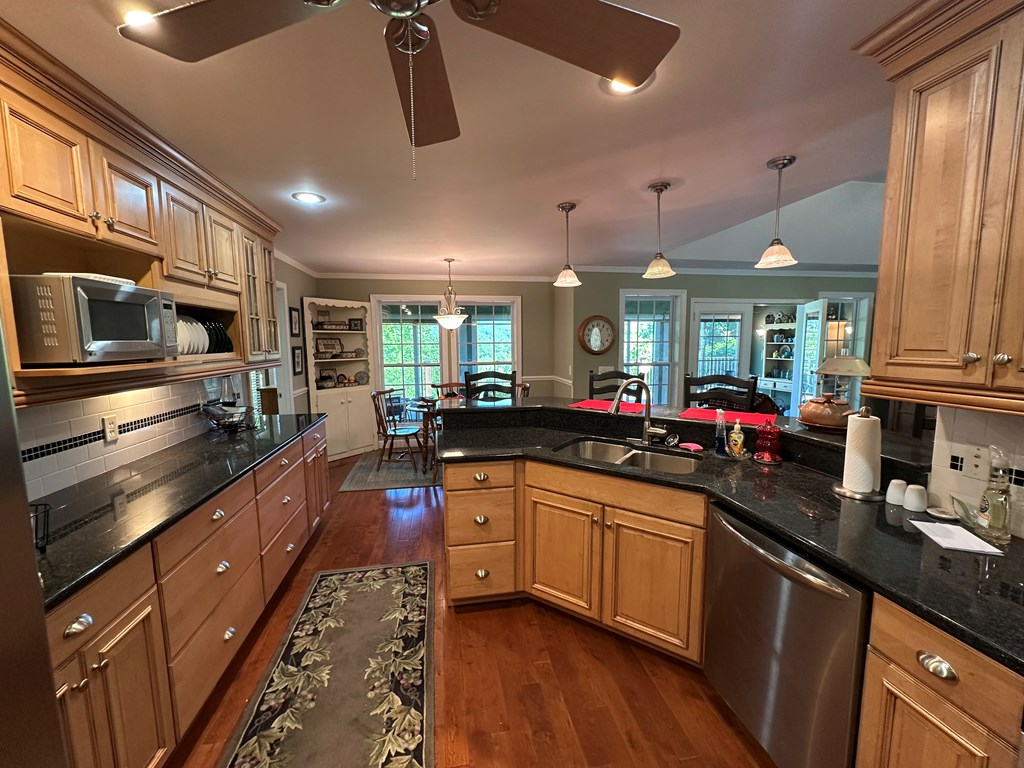 1207 Bullen Gap Road Blue Ridge, GA 30513 - Photo 13 of 37 a kitchen with lots of counter top space and stainless steel appliances
