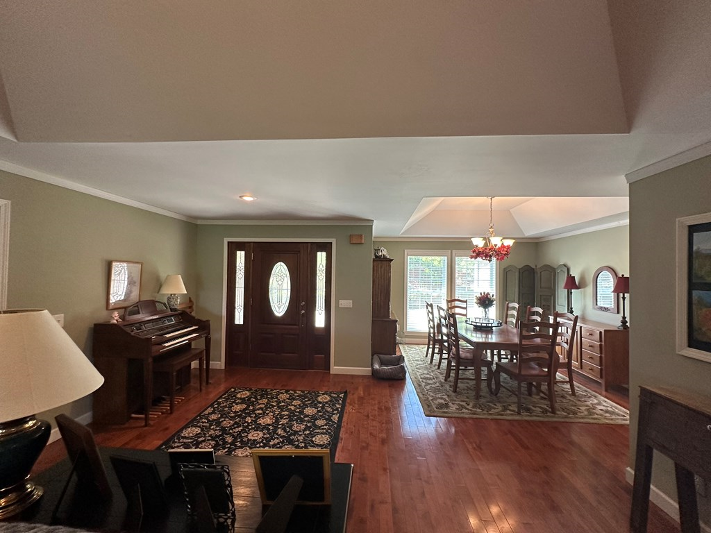 1207 Bullen Gap Road Blue Ridge, GA 30513 - Photo 18 of 37 a kitchen with a table chairs and wooden floor