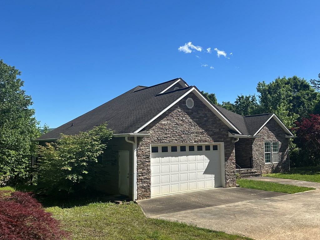 1207 Bullen Gap Road Blue Ridge, GA 30513 - Photo 20 of 37 a front view of a house with a yard and garage