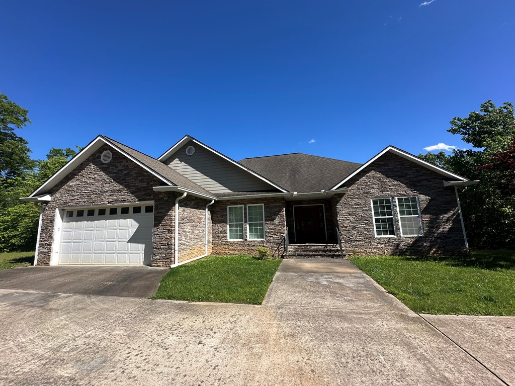 1207 Bullen Gap Road Blue Ridge, GA 30513 - Photo 2 of 37 a front view of a house with yard and green space