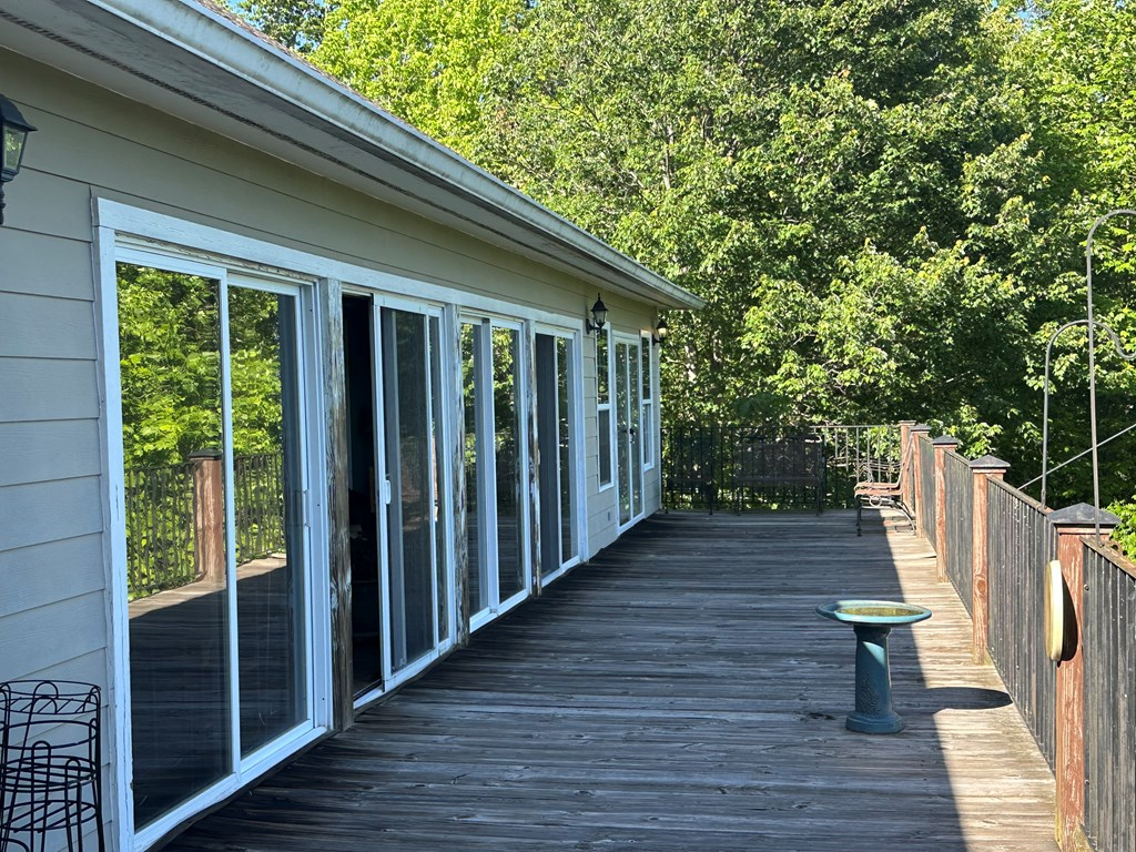 1207 Bullen Gap Road Blue Ridge, GA 30513 - Photo 21 of 37 a view of balcony with wooden floor and outdoor seating