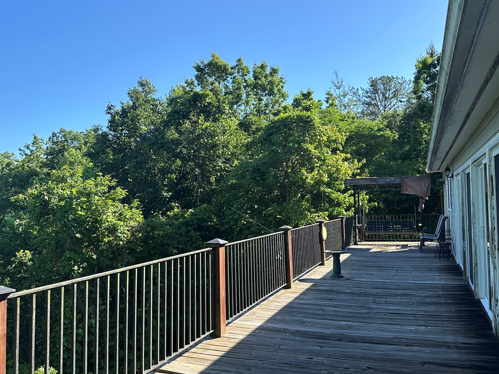 1207 Bullen Gap Road Blue Ridge, GA 30513 - Photo 24 of 37 a view of deck with wooden floor and fence