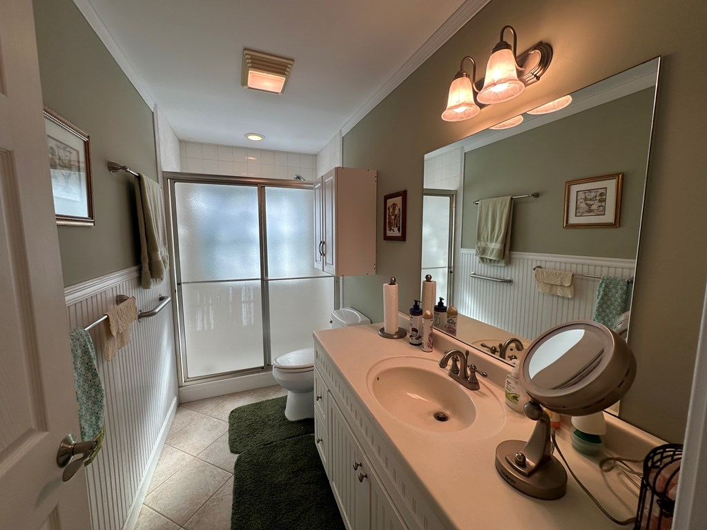 1207 Bullen Gap Road Blue Ridge, GA 30513 - Photo 26 of 37 a bathroom with a sink a toilet a mirror and shower