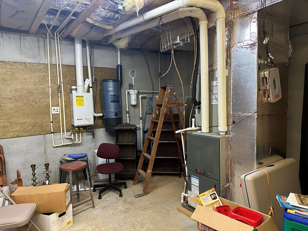 1207 Bullen Gap Road Blue Ridge, GA 30513 - Photo 32 of 37 a room with furniture a rug and a window