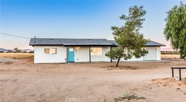 a house with trees in front of it