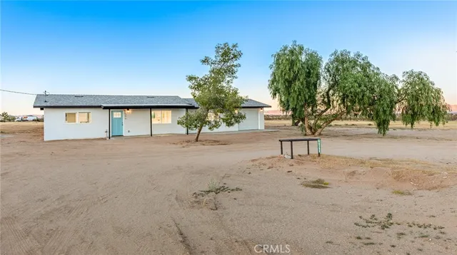 a view of backyard of a house