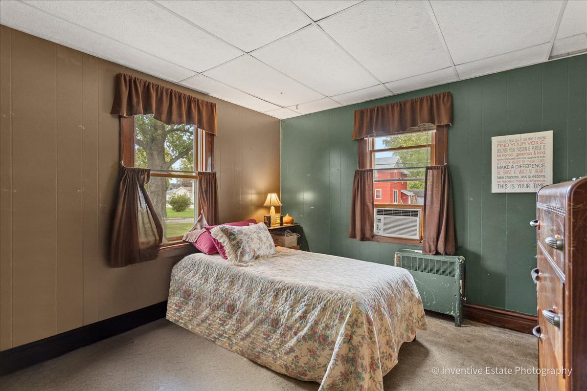 30736 South Symerton Road Wilmington, IL 60481 - Photo 12 of 25 a bedroom with a bed next to a window
