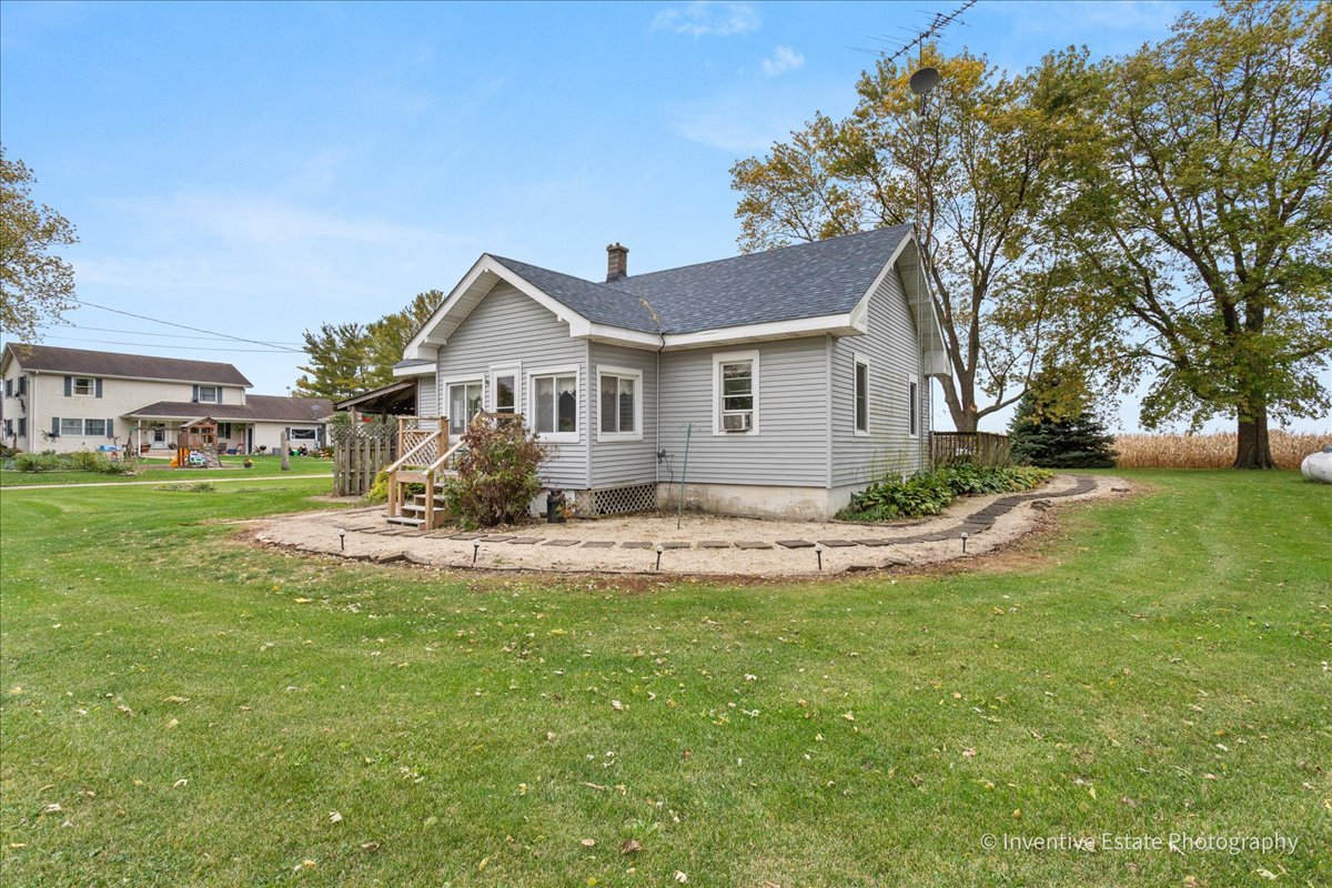 30736 South Symerton Road Wilmington, IL 60481 - Photo 21 of 25 a view of a house with a big yard and large trees