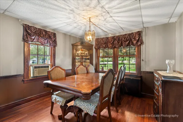 a view of a dining room with furniture window and outside view