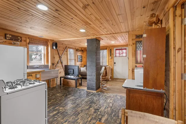 a view of a kitchen with furniture and floor to ceiling window
