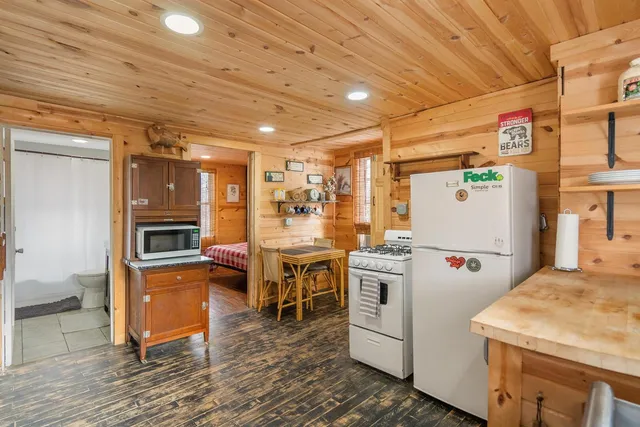a kitchen with refrigerator and stove