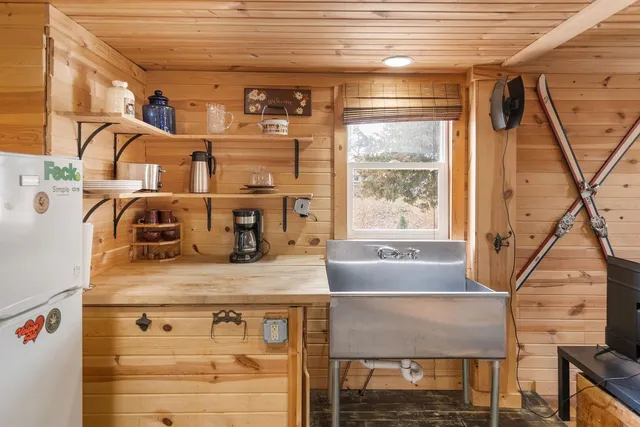 a view of front door with washer and dryer
