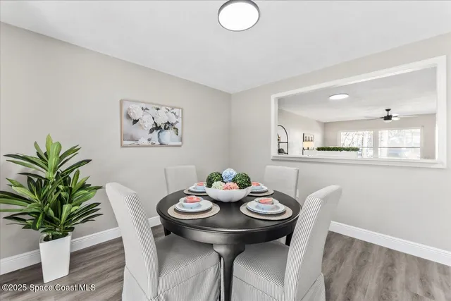 a bedroom with a bed and a ceiling fan