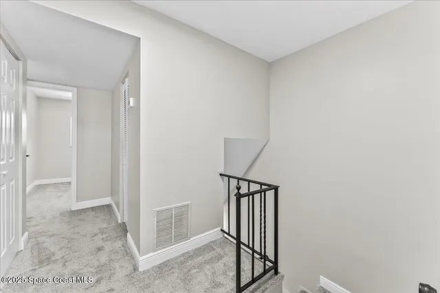 a bedroom with a large bed and a large window