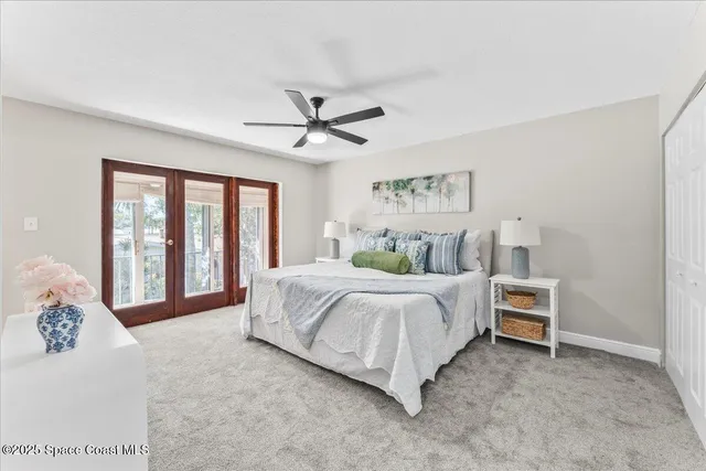 a view of a room with wooden floor and windows