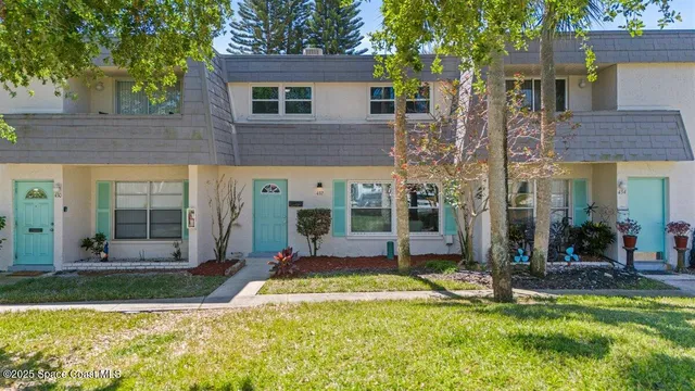 a view of a house with swimming pool and a porch