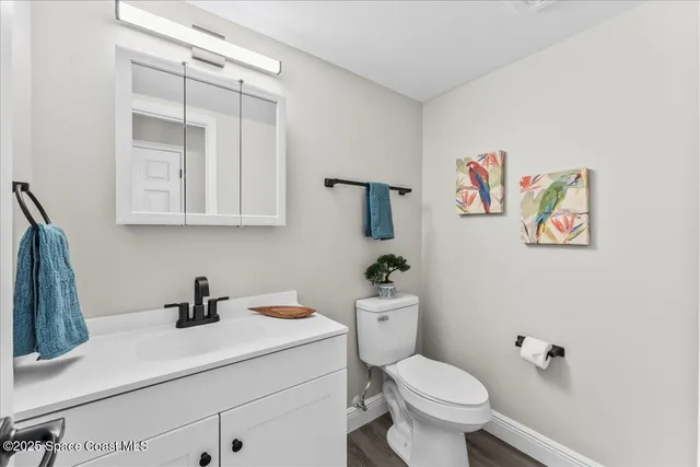 a view of a room with window wooden floor and door