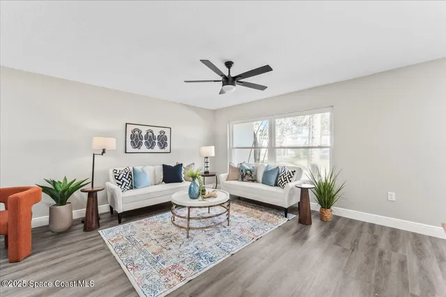 a living room with furniture and a rug