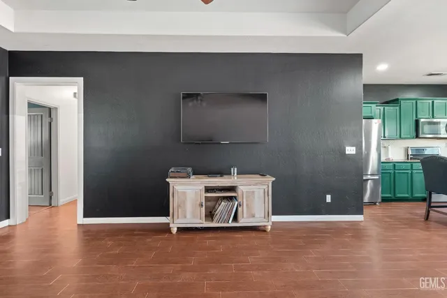 a view of a livingroom with furniture and wooden floor