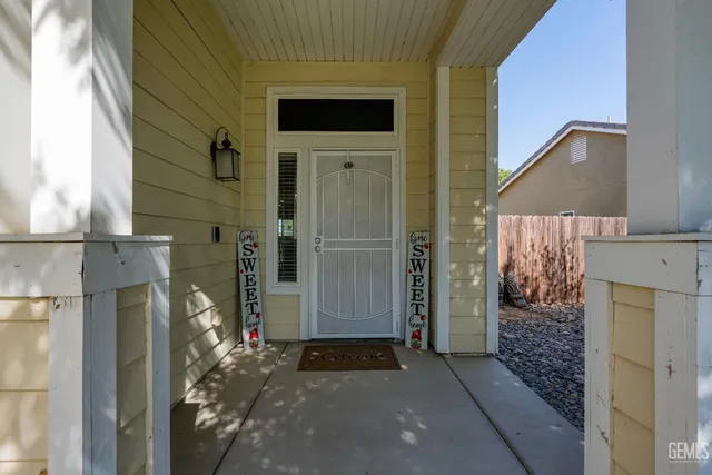a view of a house with a door and wooden door