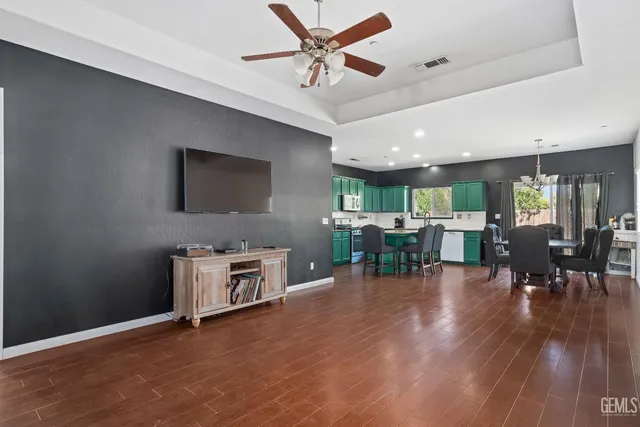 a kitchen with a table chairs and a stove