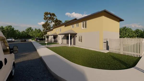 a front view of a house with a yard