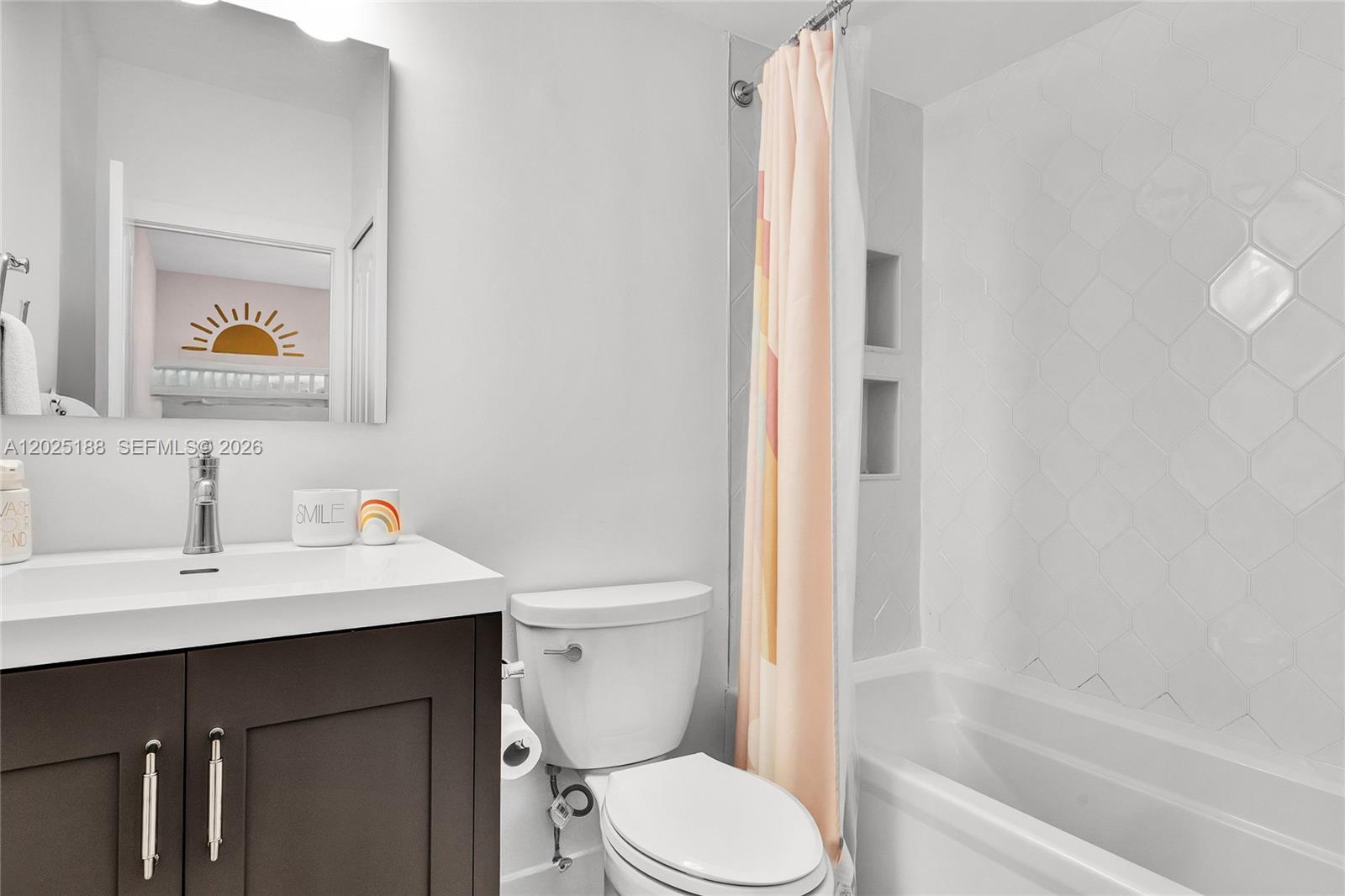 7620 Southwest 102nd Street, Unit 121 Pinecrest, FL 33156 - Photo 12 of 18 a bathroom with a sink a toilet and shower