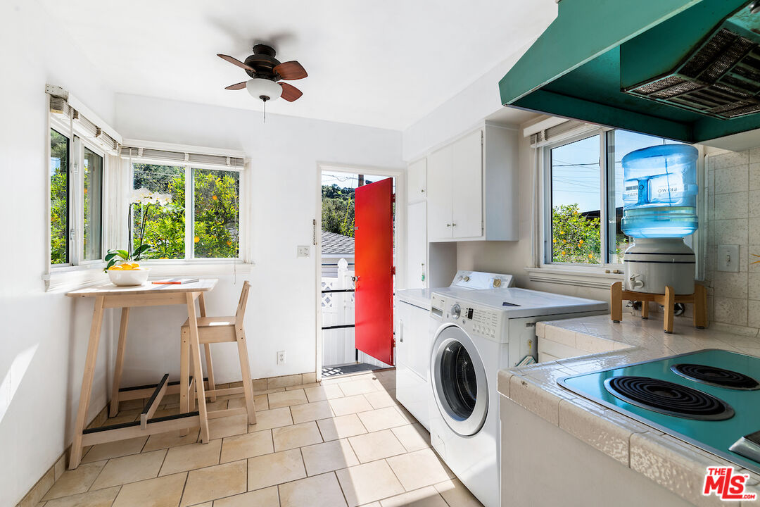 1856 Alpha Road Glendale, CA 91208 - Photo 15 of 32 a kitchen with a refrigerator and windows