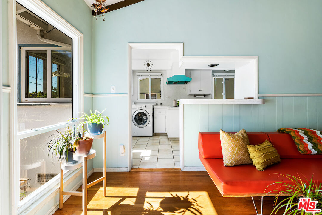1856 Alpha Road Glendale, CA 91208 - Photo 17 of 32 a living room with a couch and a table with wooden floor