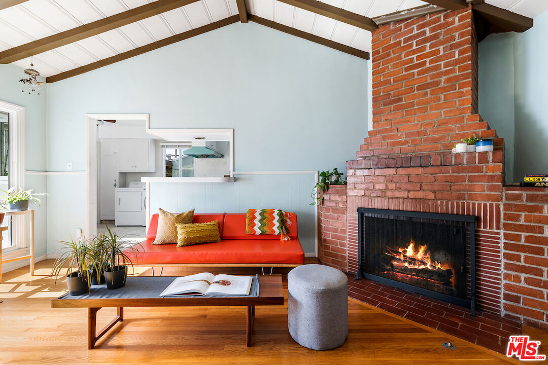 1856 Alpha Road Glendale, CA 91208 - Photo 18 of 32 a living room with furniture a fireplace and a fireplace