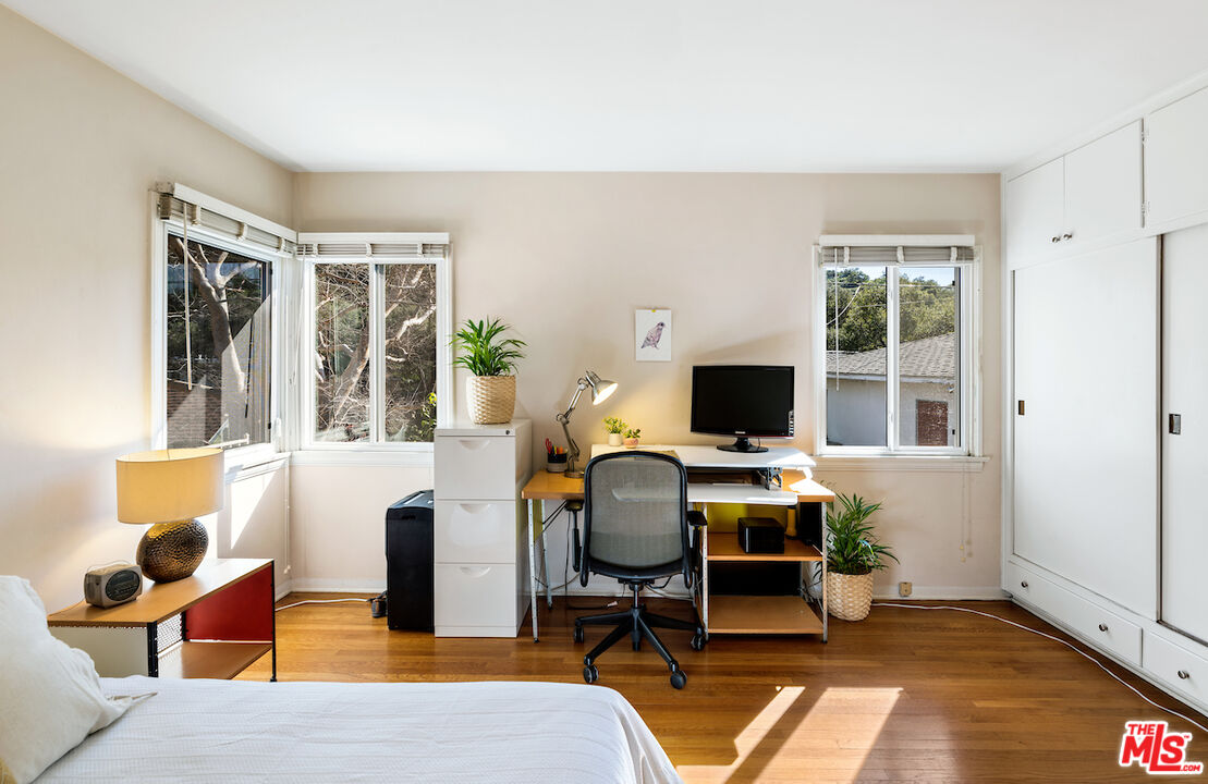 1856 Alpha Road Glendale, CA 91208 - Photo 22 of 32 a view of a workspace with furniture and a window
