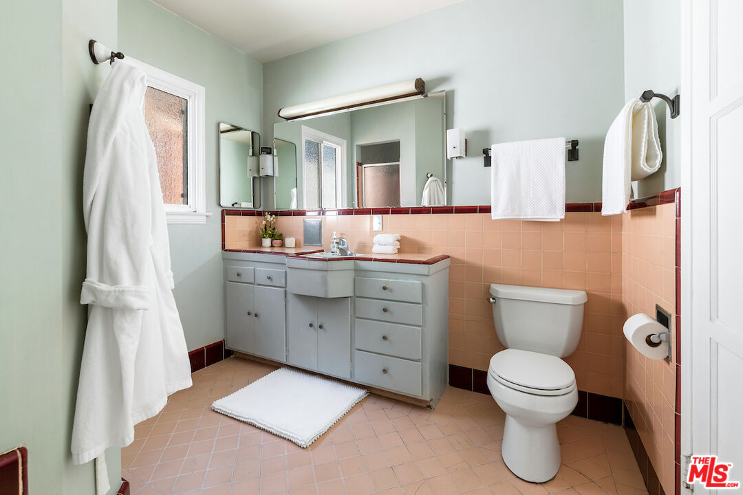 1856 Alpha Road Glendale, CA 91208 - Photo 24 of 32 a bathroom with a toilet sink and mirror