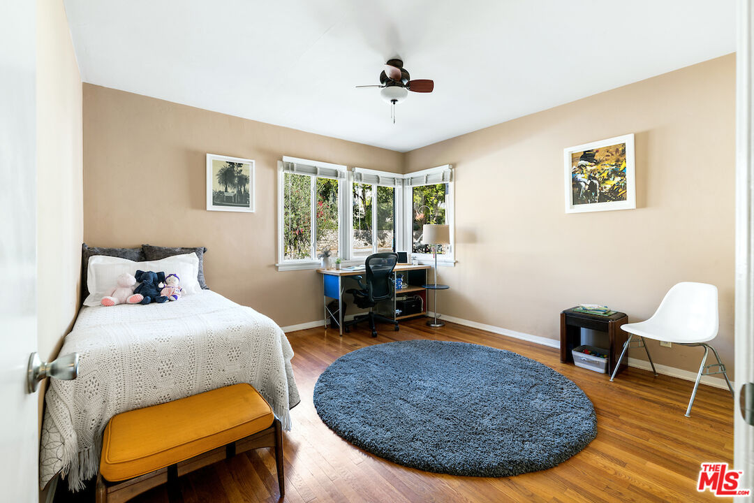 1856 Alpha Road Glendale, CA 91208 - Photo 26 of 32 a bedroom with bed and a chair